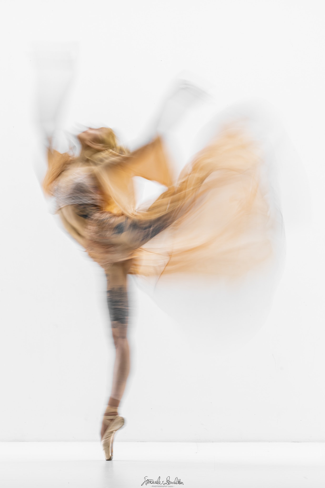 A dancer rendered as a flowing study of movement in a pale studio